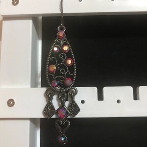 One earring from Tibet.